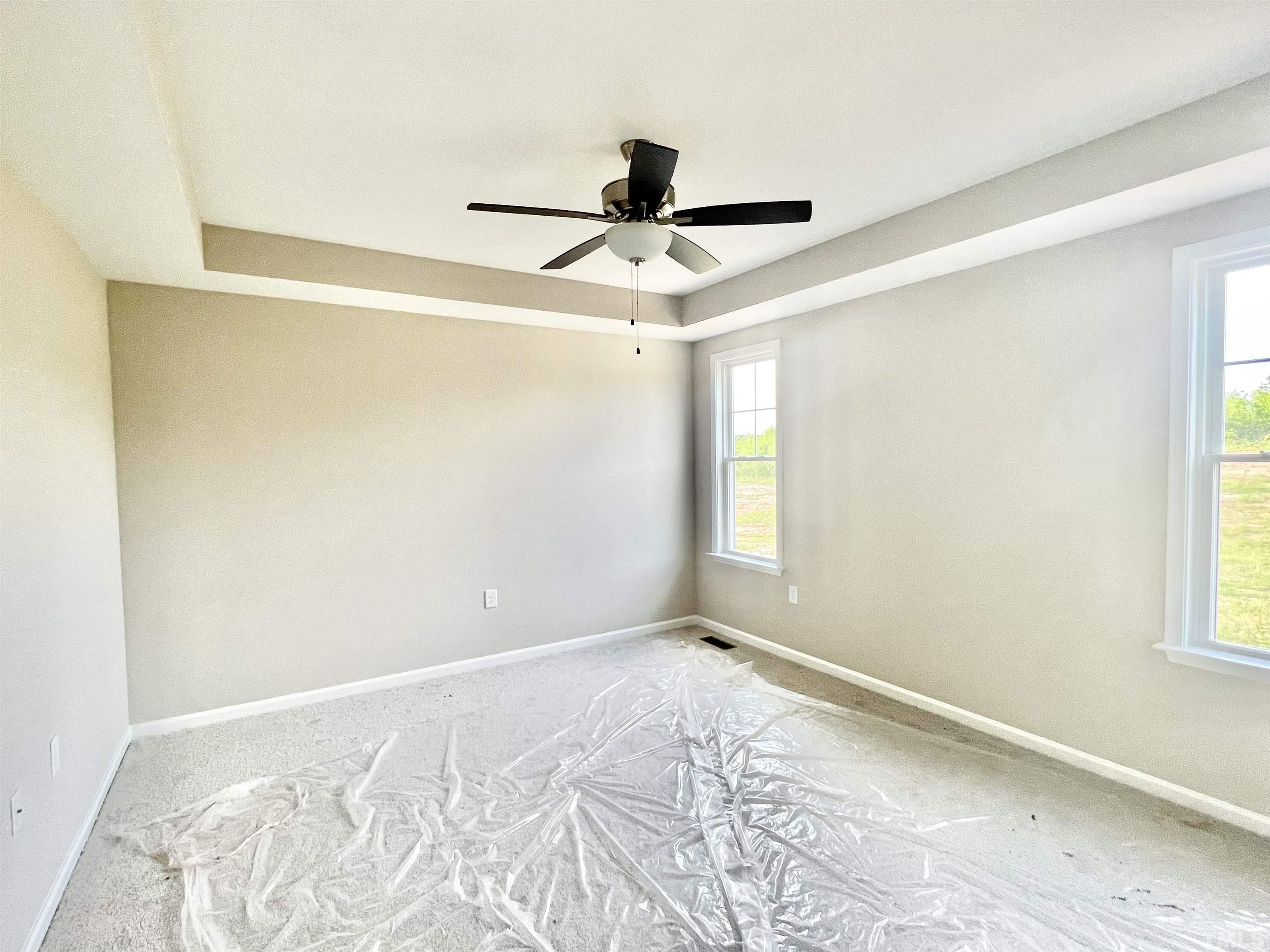 4525 Debnam Road Zebulon, NC 27597 - Photo 9 of 10 a view of a room with a window and a ceiling fan