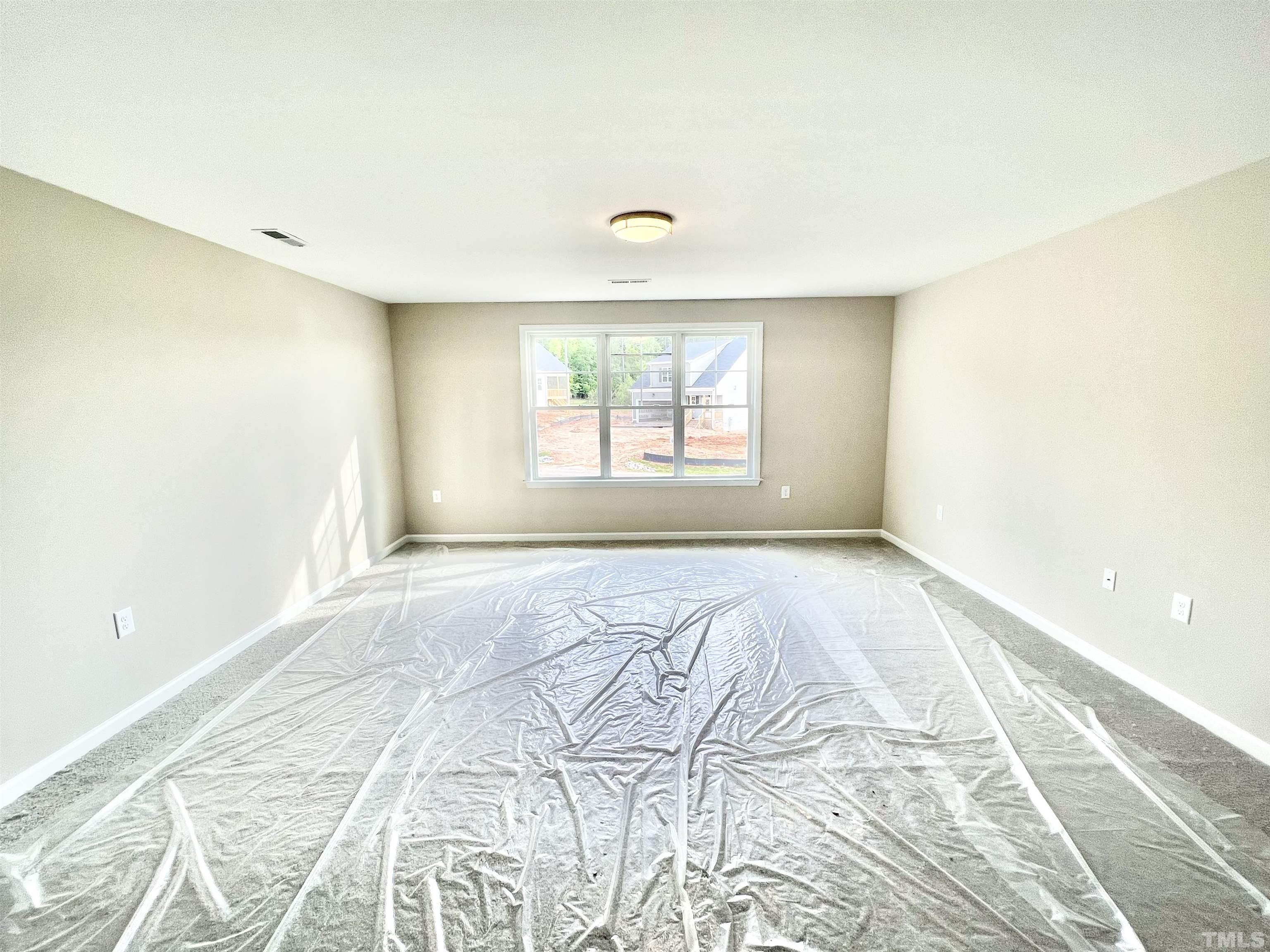 4525 Debnam Road Zebulon, NC 27597 - Photo 10 of 10 an empty room with a window