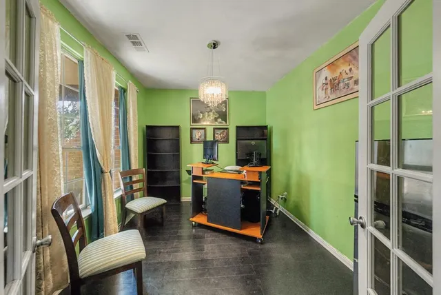 a view of a livingroom with furniture and a window