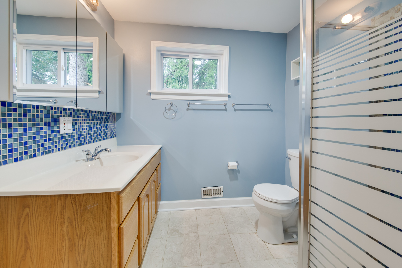 2108 Harrison Street Evanston, IL 60201 - Photo 15 of 16 a bathroom with a sink a toilet and window