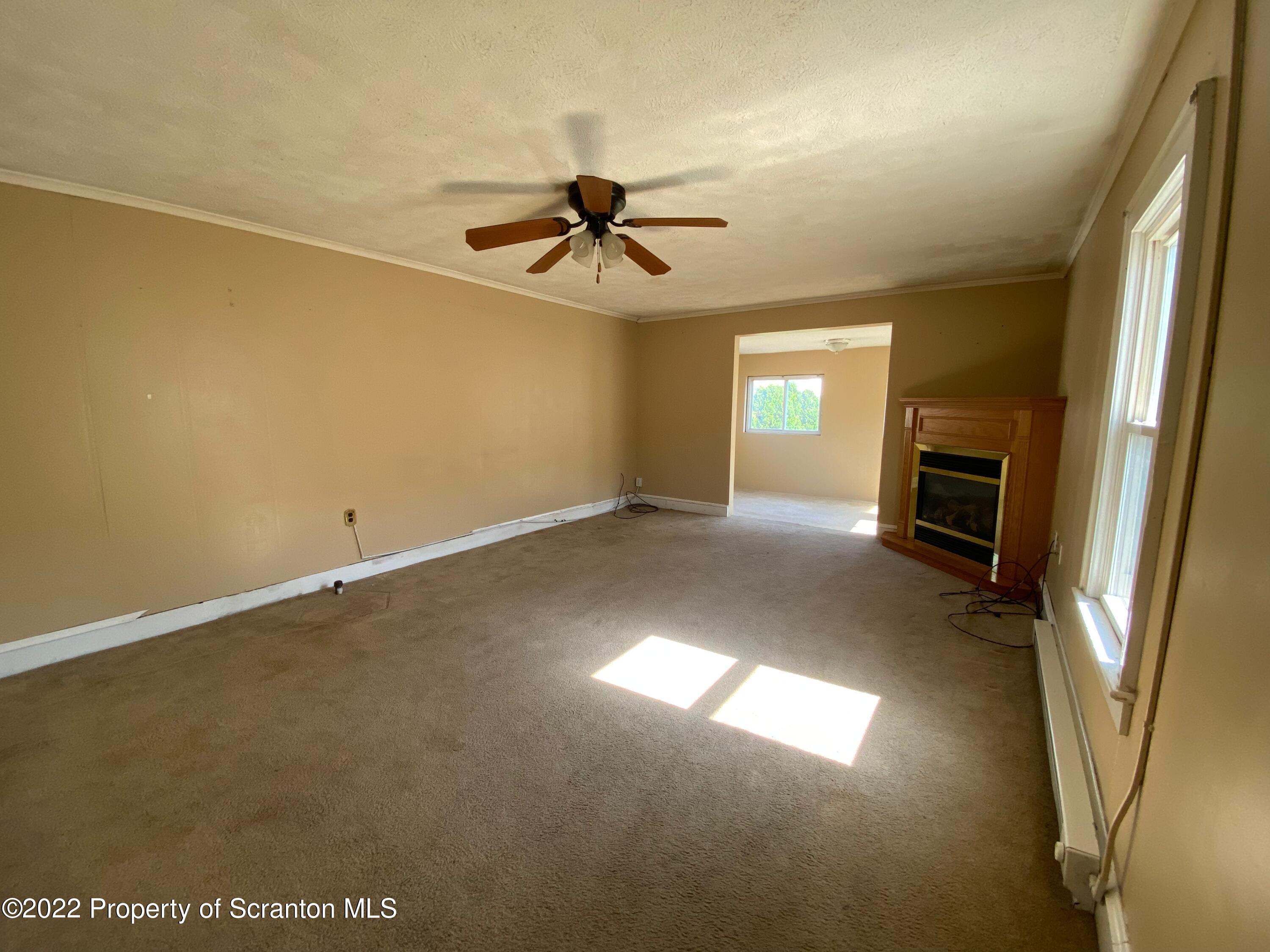 600 Main Street Moosic, PA 18507 - Photo 14 of 19 an empty room with windows and fireplace