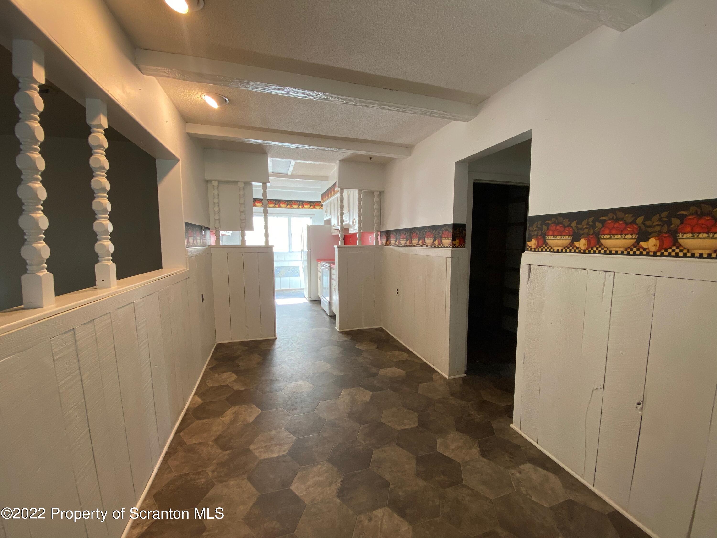 600 Main Street Moosic, PA 18507 - Photo 7 of 19 a view of a kitchen with refrigerator and a stove