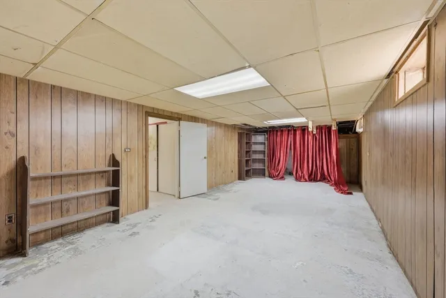 a view of an empty room with furniture