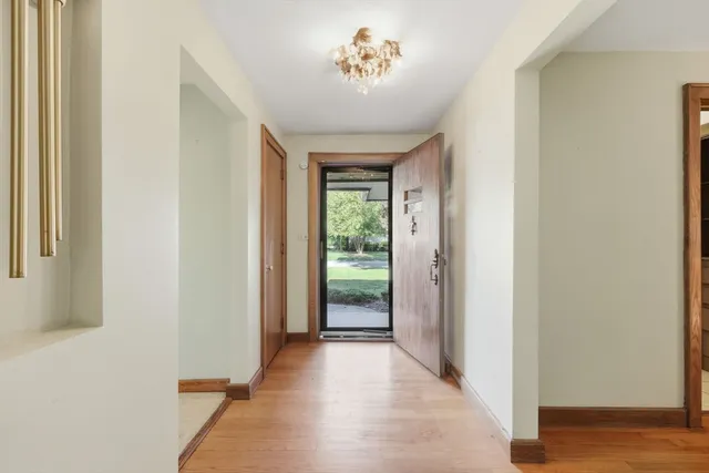 a view of entryway with wooden floor