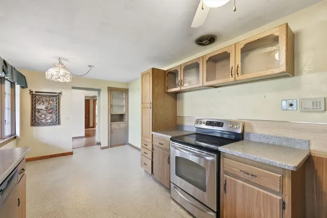 a kitchen that has a stove and a sink