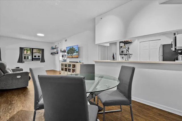 a kitchen with cabinets stainless steel appliances and a counter space