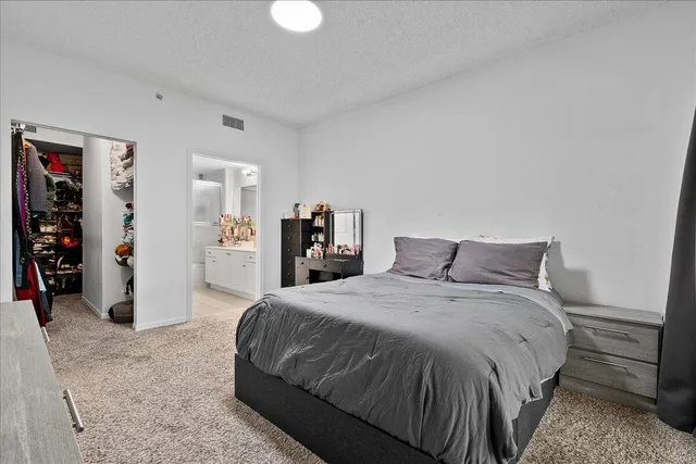 a bathroom with a double vanity sink mirror shower and bathtub