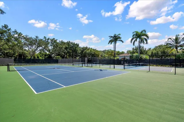 a outdoor sitting area with furniture and wooden floor