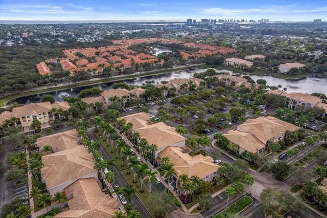 an aerial view of residential houses with city and mountain view