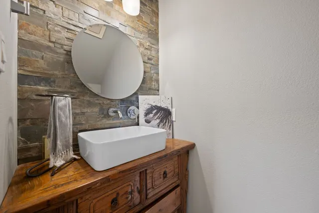 a view of a livingroom with a flesh screen tv and fireplace