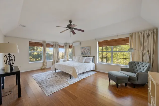 a large spacious bathroom with a large tub and shower