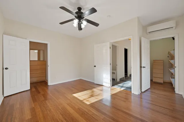 a view of a room with furniture and a window