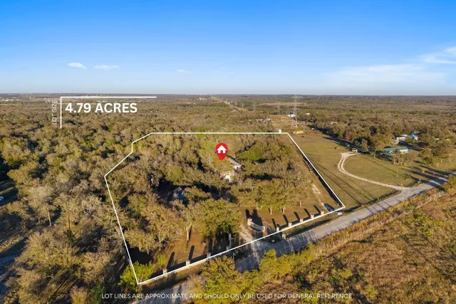 a view of a house with a door and wooden floor