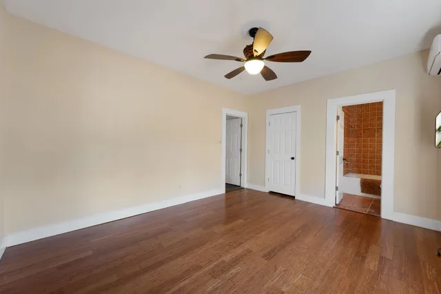 a view of a balcony with wooden floor and outdoor space