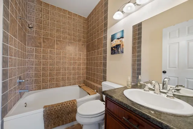 a view of a house with backyard and sitting area