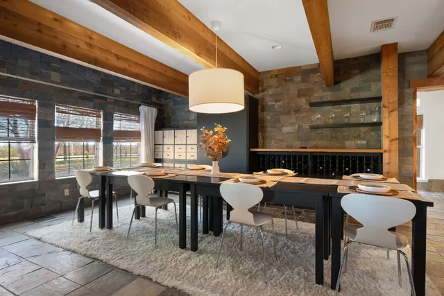 a view of a dining hall with many windows