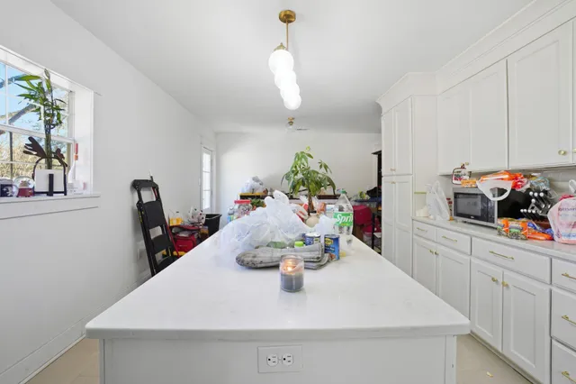 a view of dining room and kitchen island