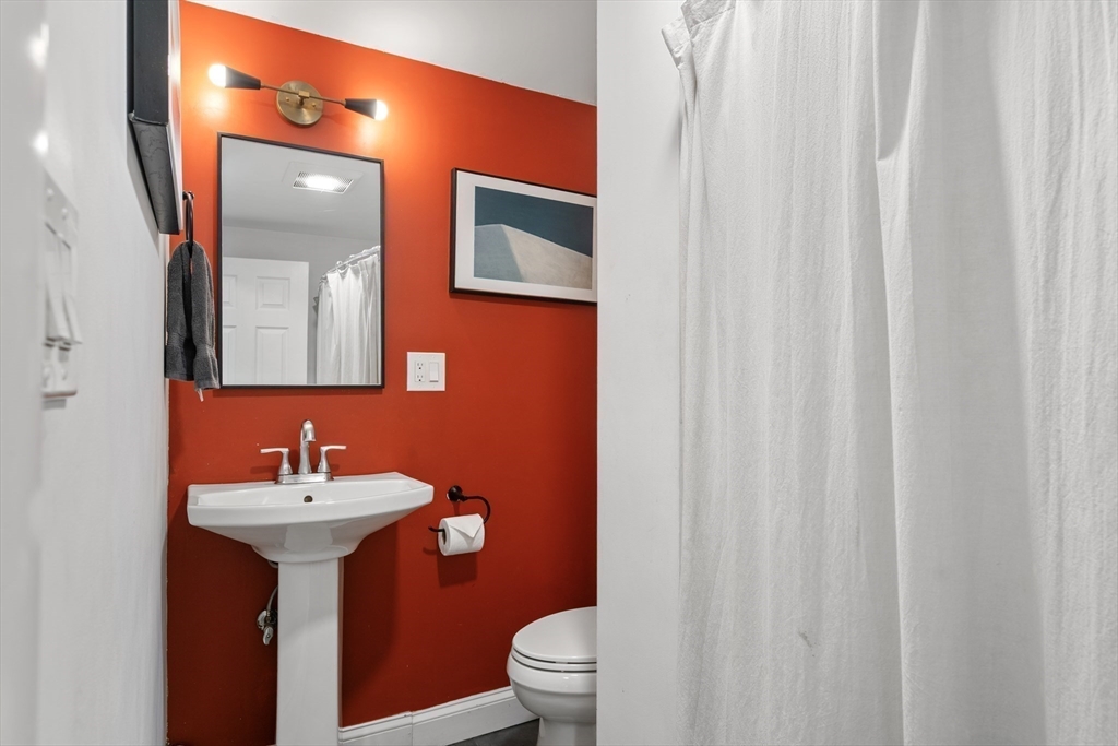 1 Dow Road Boston, MA 02132 - Photo 21 of 28 a bathroom with a sink toilet and mirror
