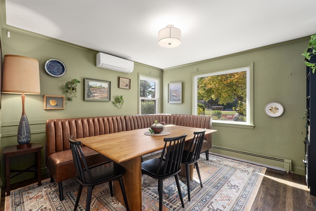1 Dow Road Boston, MA 02132 - Photo 5 of 28 a view of a dining room with furniture and wooden floor