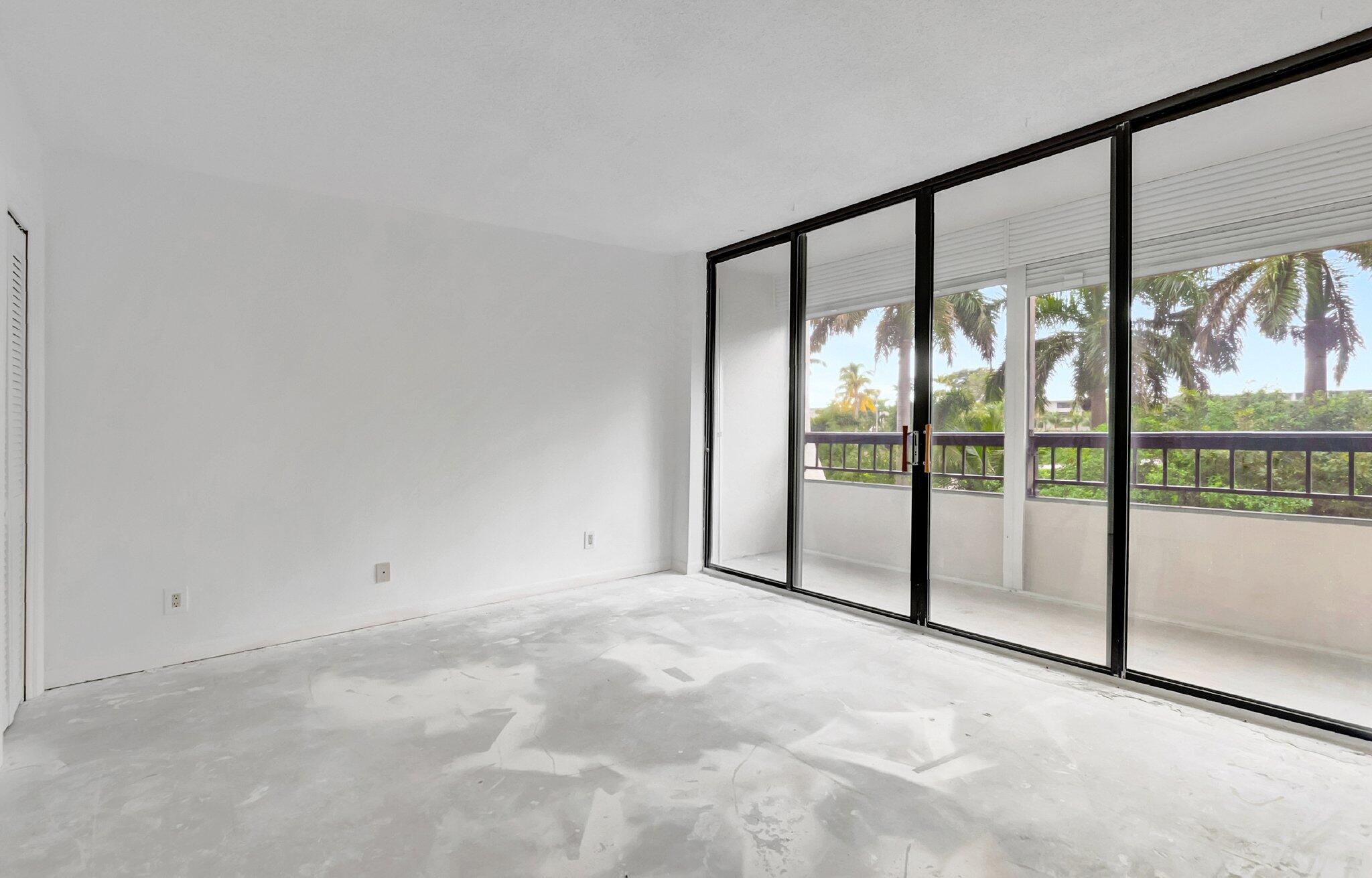 6320 Boca Del Mar Drive, Unit 301 Boca Raton, FL 33433 - Photo 13 of 46 a view of an empty room with windows