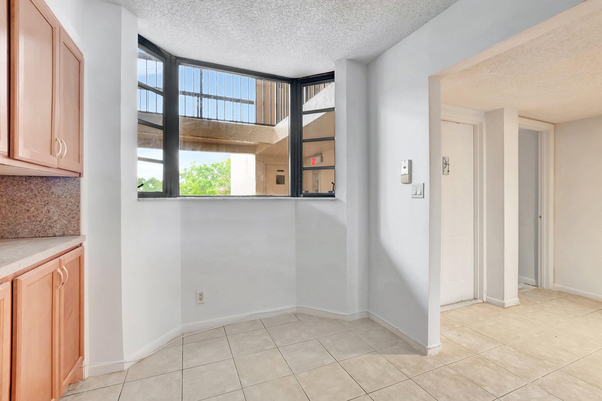 6320 Boca Del Mar Drive, Unit 301 Boca Raton, FL 33433 - Photo 17 of 46 an empty room with windows