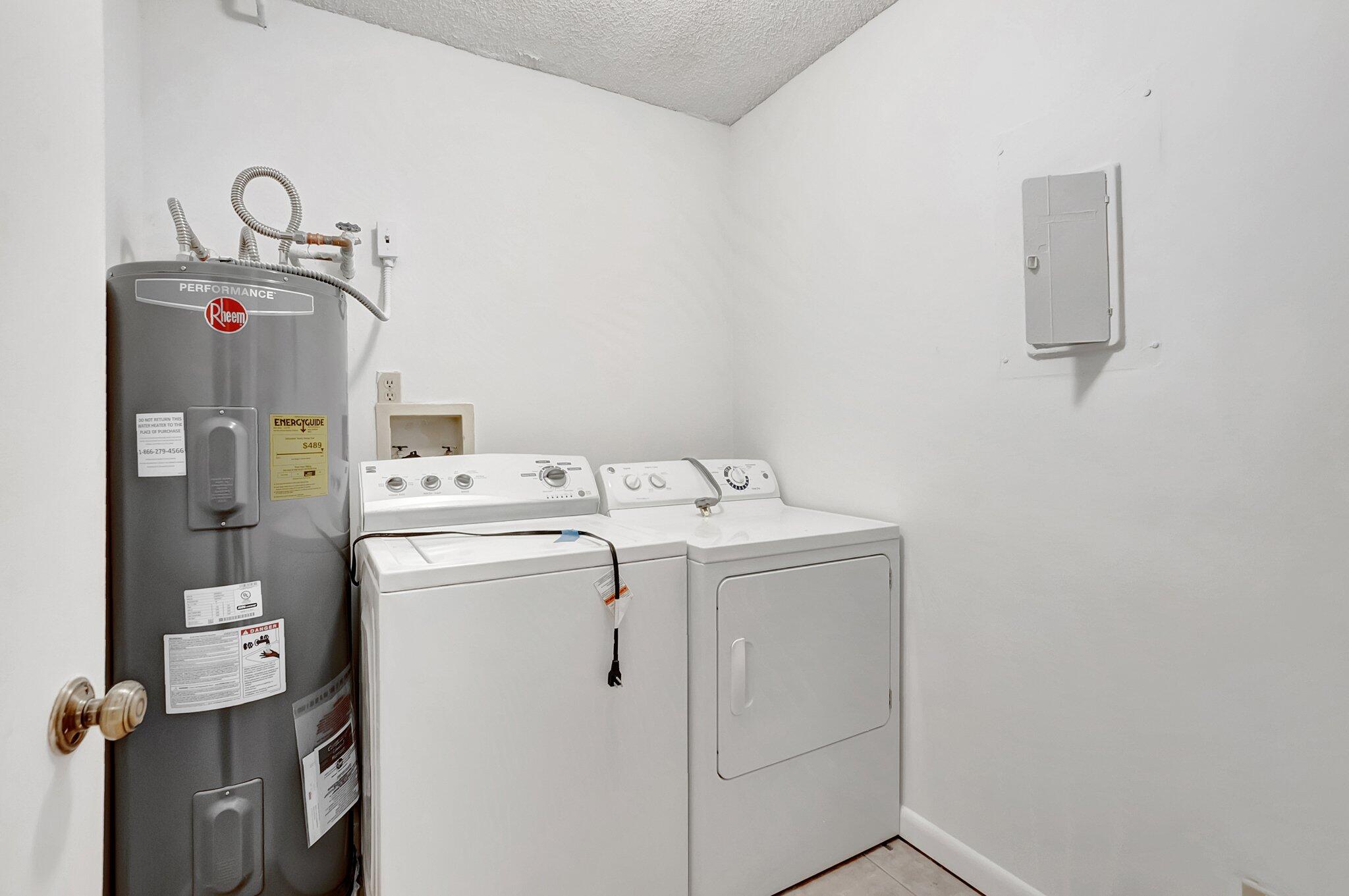 6320 Boca Del Mar Drive, Unit 301 Boca Raton, FL 33433 - Photo 19 of 46 a utility room with dryer and washer