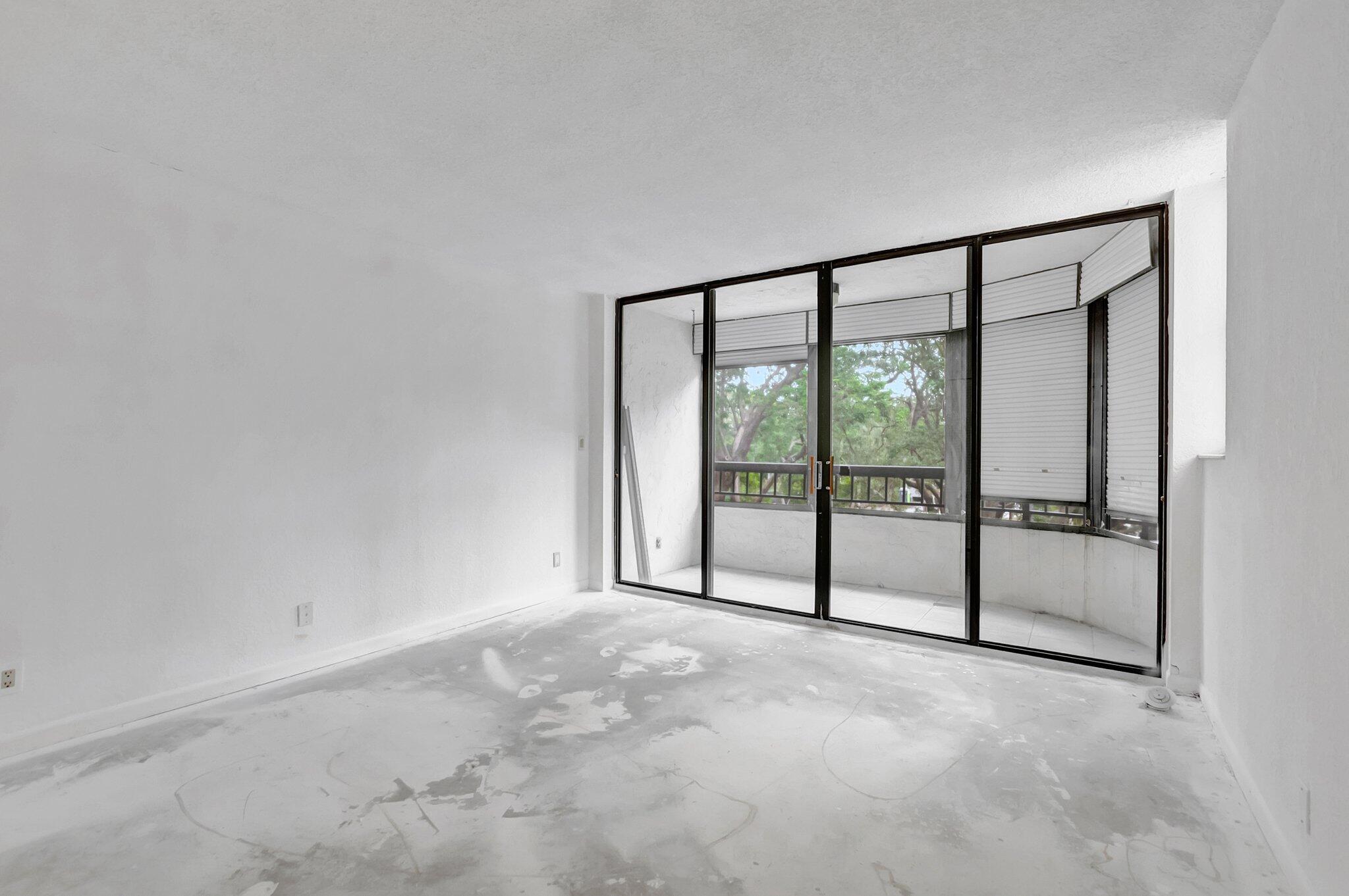 6320 Boca Del Mar Drive, Unit 301 Boca Raton, FL 33433 - Photo 26 of 46 a view of an empty room with sliding door
