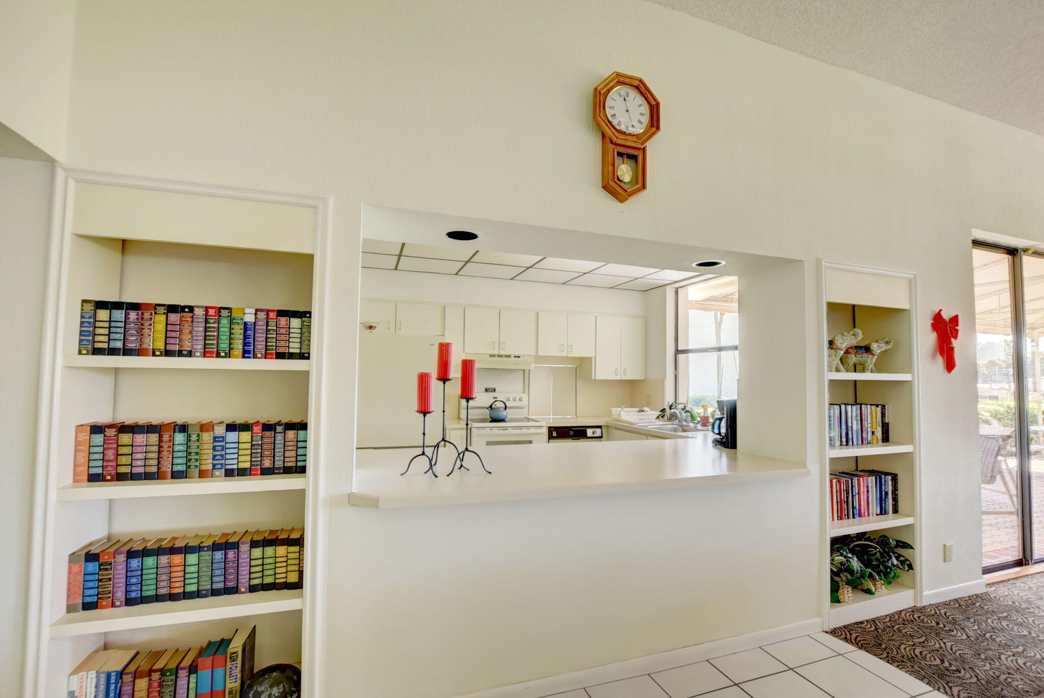 6320 Boca Del Mar Drive, Unit 301 Boca Raton, FL 33433 - Photo 35 of 46 a room with furniture and a book shelf
