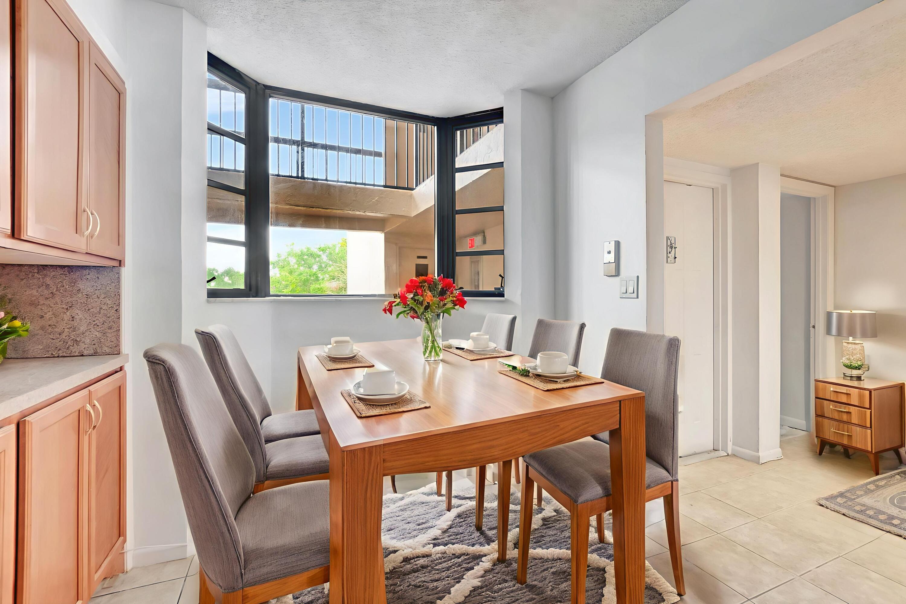 6320 Boca Del Mar Drive, Unit 301 Boca Raton, FL 33433 - Photo 4 of 46 a dining room with furniture and window