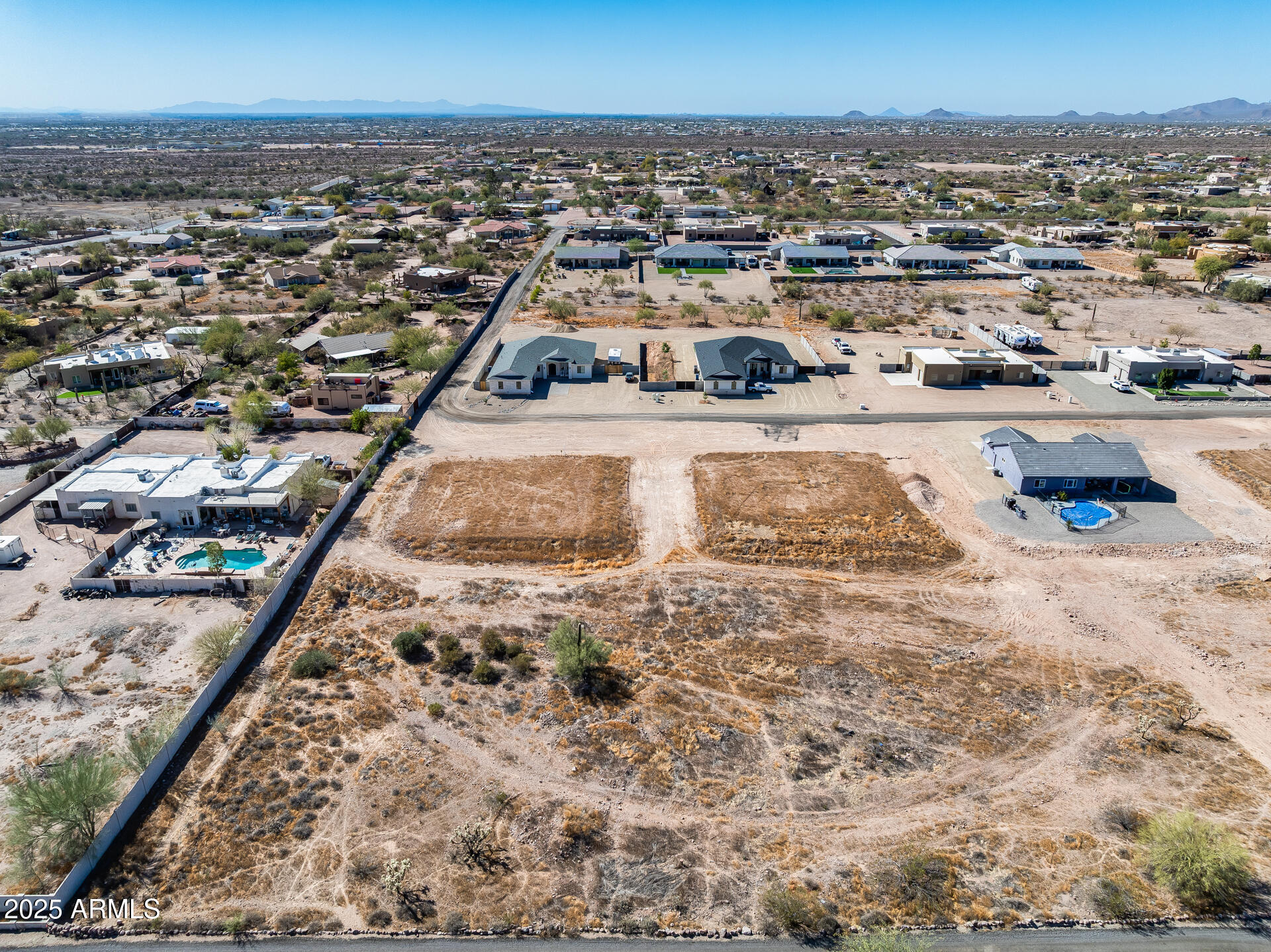 573 South Sun Road, Unit 1 Apache Junction, AZ 85119 - Photo 8 of 21 an aerial view of residential houses with outdoor space