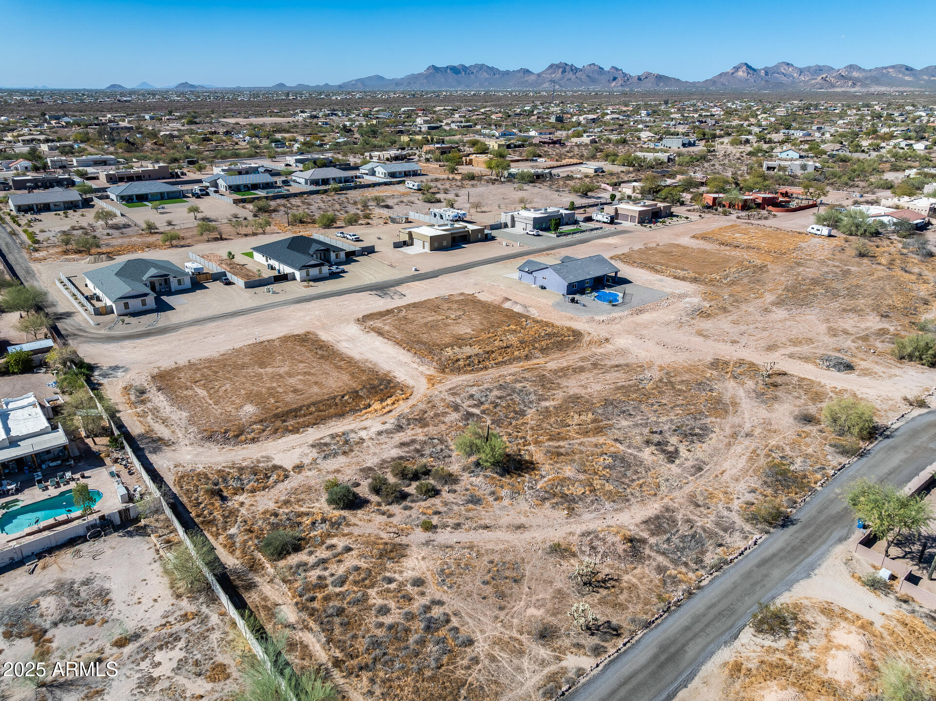 573 South Sun Road, Unit 1 Apache Junction, AZ 85119 - Photo 9 of 21 an aerial view of residential houses with outdoor space