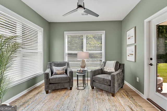a living room with furniture and a window
