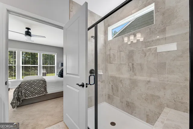 a bathroom with a tub shower and sink