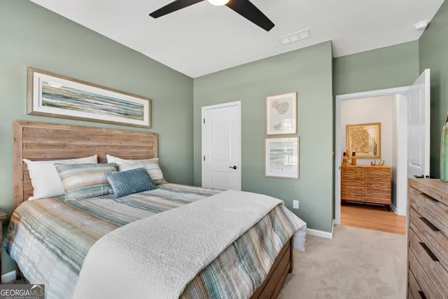 a bedroom with a bed and a walk in closet