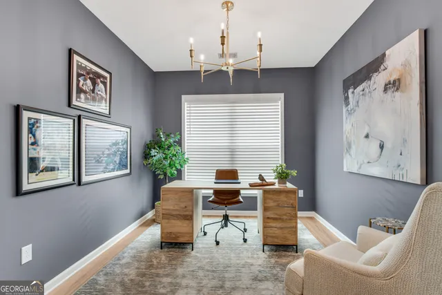 a work room with furniture and windows