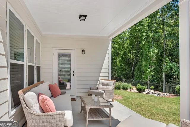 a view of a garden with a building in the background