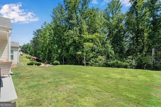 a view of a house with a back yard