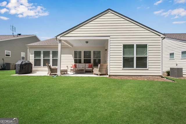 a front view of a house with a garden and porch