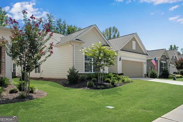 a view of a house with garden and plants
