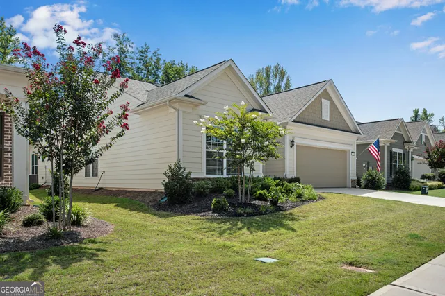 a front view of a house with garden