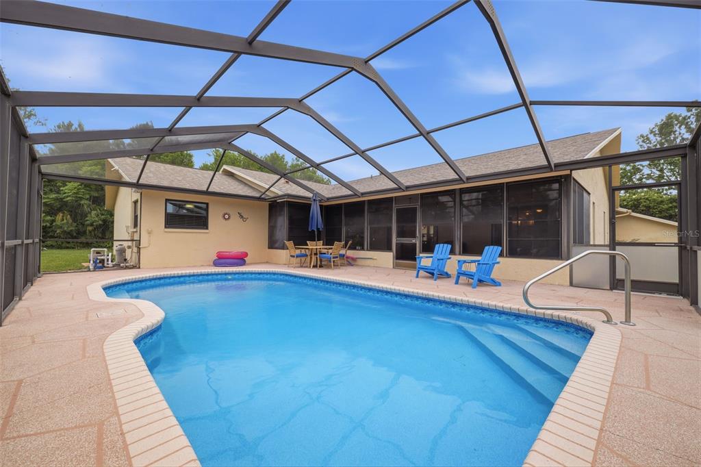 5227 Suwannee Road Weeki Wachee, FL 34607 - Photo 2 of 62 a view of a swimming pool with a patio
