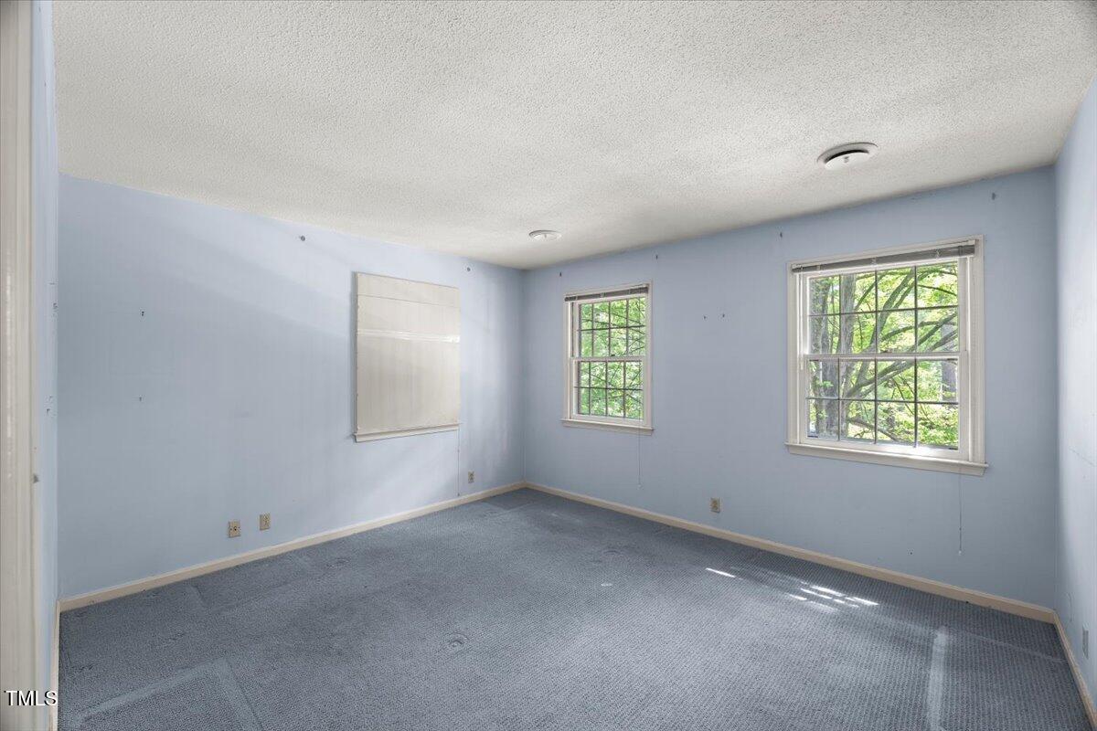 3025 Wycliff Road Raleigh, NC 27607 - Photo 23 of 40 an empty room with windows
