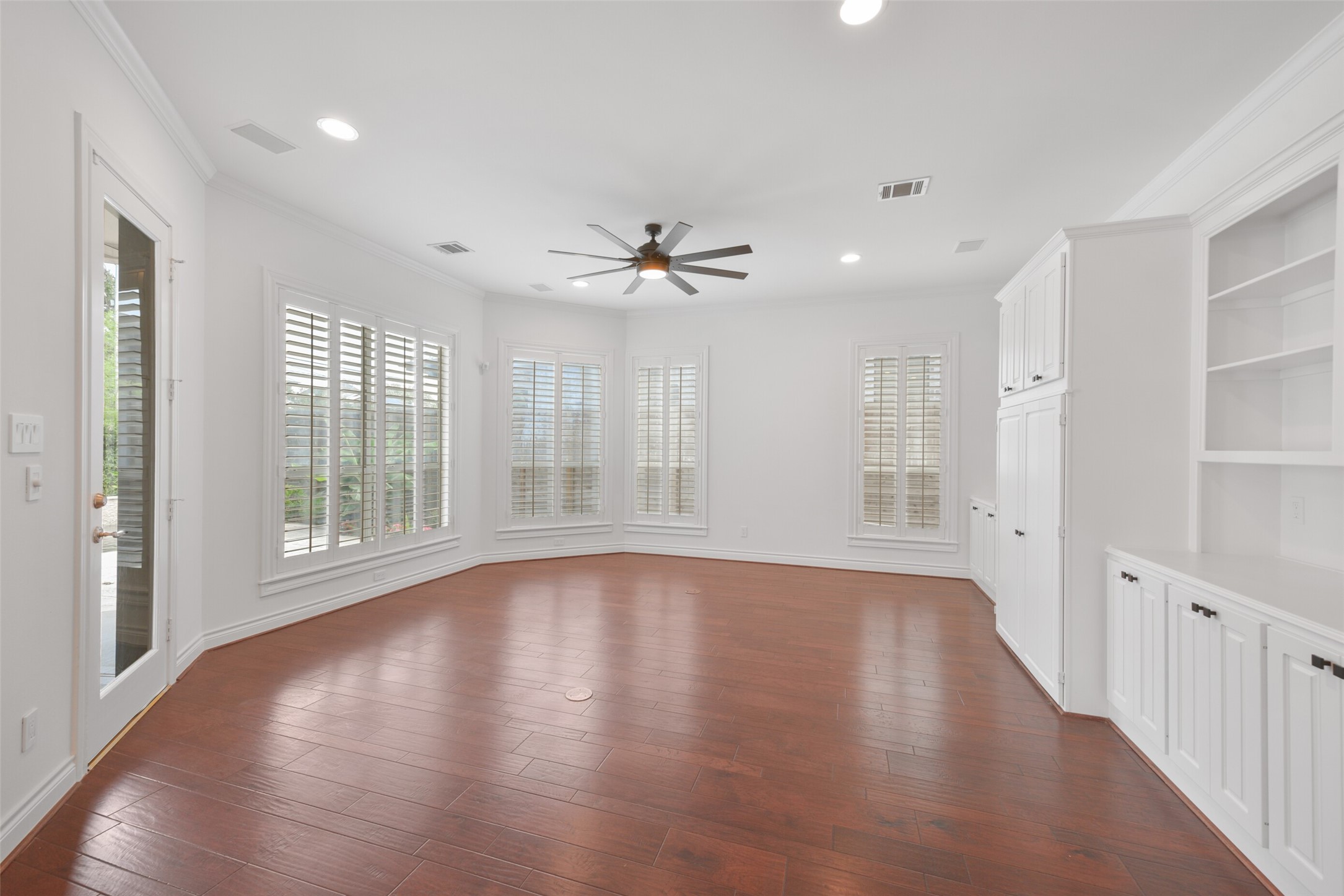 3724 Wroxton Road Houston, TX 77005 - Photo 10 of 40 The living room, with windows and french door, overlooks the covered patio and pool.