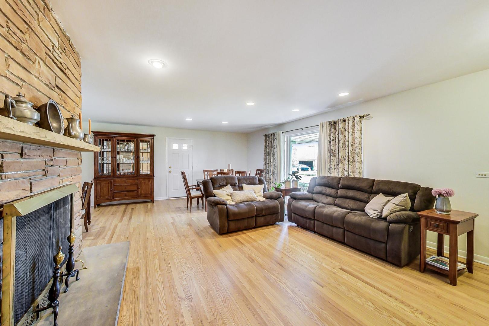 3018 Farrell Avenue Park Ridge, IL 60068 - Photo 6 of 34 a living room with furniture and a fireplace