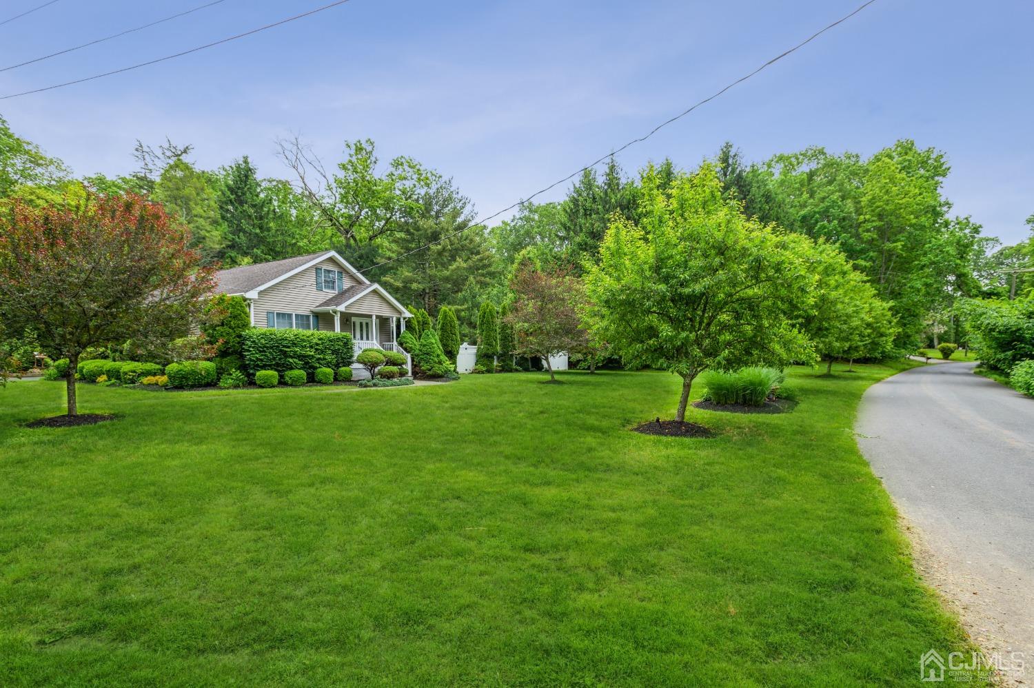 44 Chambers Road Cream Ridge, NJ 08514 - Photo 1 of 27 a front view of a house with garden