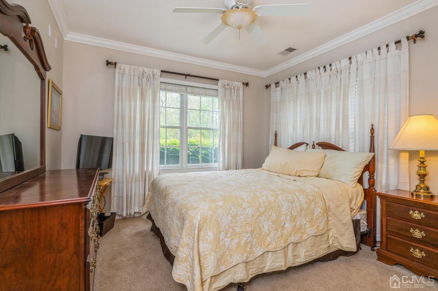 44 Chambers Road Cream Ridge, NJ 08514 - Photo 13 of 27 a bedroom with bed and window with lamp