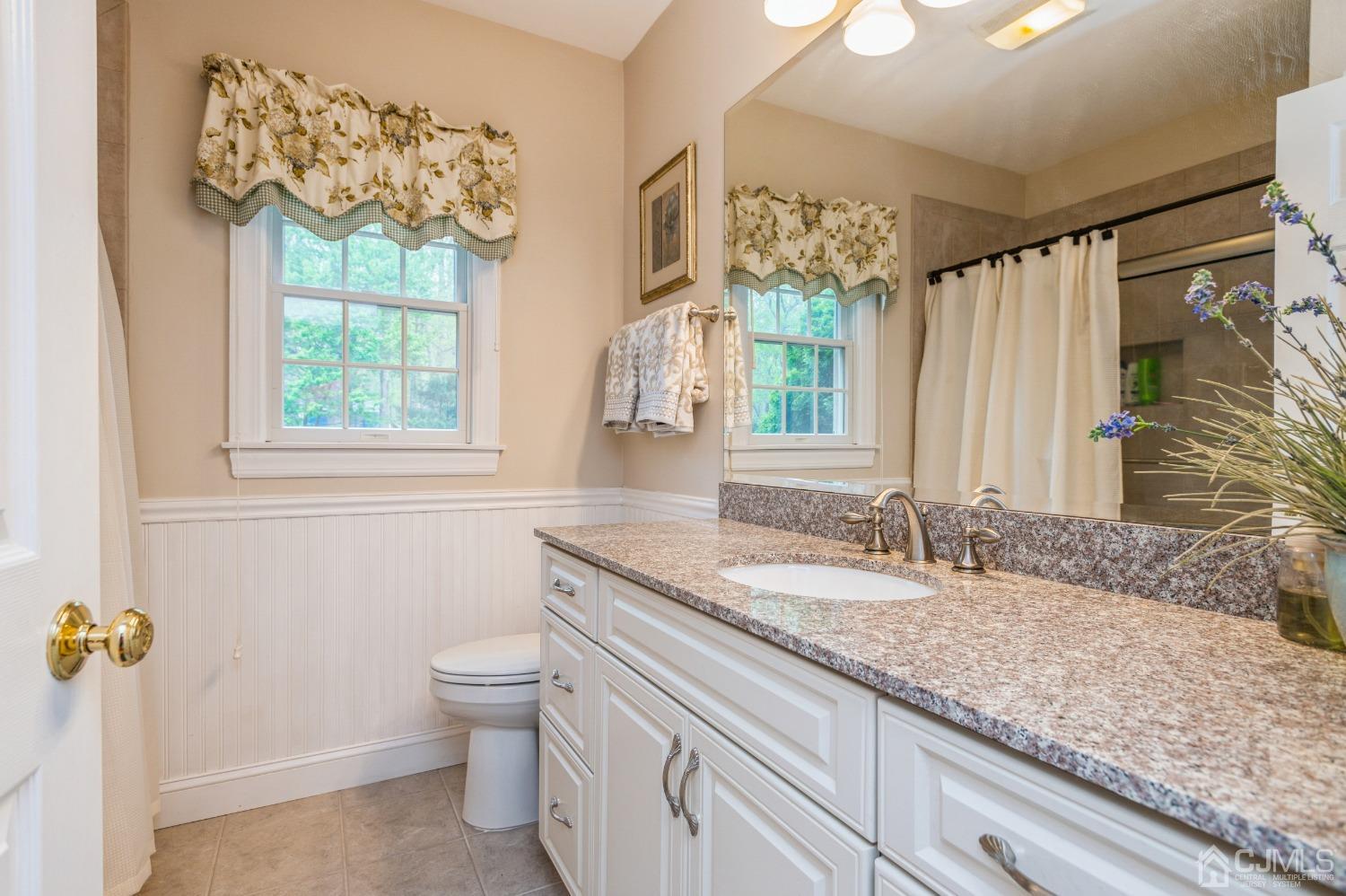 44 Chambers Road Cream Ridge, NJ 08514 - Photo 16 of 27 a bathroom with a granite countertop sink and a mirror