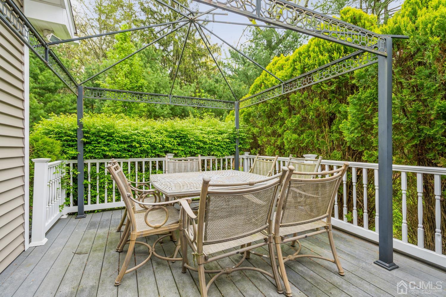 44 Chambers Road Cream Ridge, NJ 08514 - Photo 20 of 27 a view of a chairs and table on the wooden deck