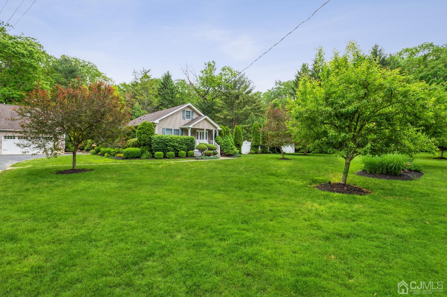44 Chambers Road Cream Ridge, NJ 08514 - Photo 2 of 27 a front view of a house with a yard