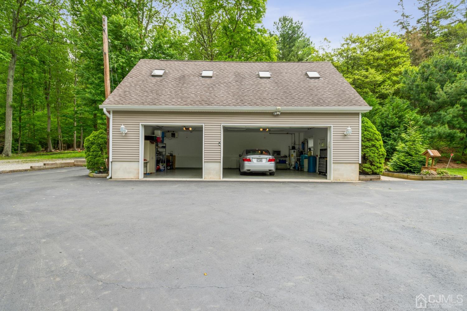 44 Chambers Road Cream Ridge, NJ 08514 - Photo 22 of 27 front view of a house with a yard and a garage